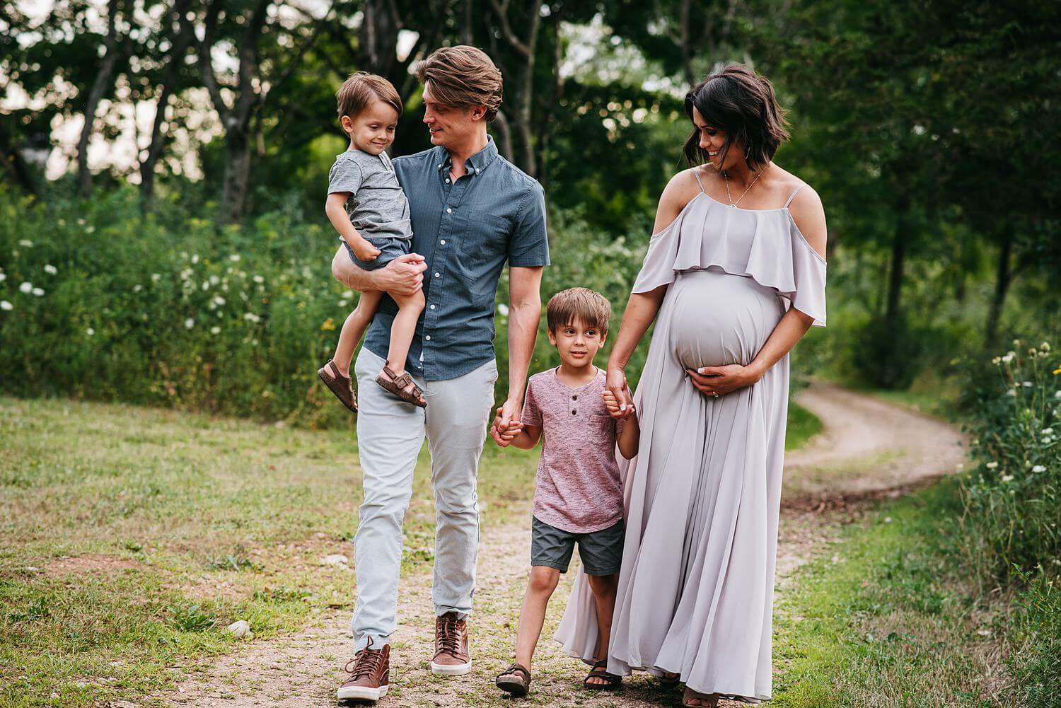 appleton maternity photographer family walking by daphodil photo